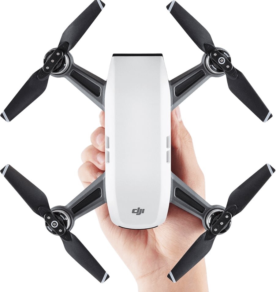 curso-de-piloto-drones vista de la parte de arriba de un drone dji spark y una mano sujetandolo